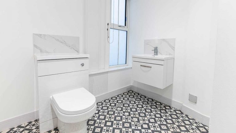 Mosaic Tiled Classic Finished Bathroom With White Gloss Units And Grohe Fitted Sanitry Ware