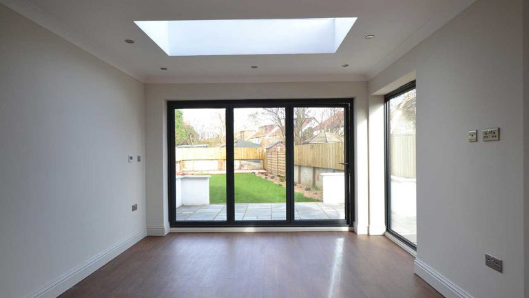 Skylight Velux Bringing Natural Light Into An Open Living Area With Bifold Openings